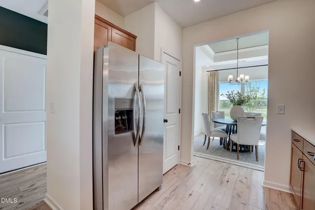a walk in closet and a large mirror in a room
