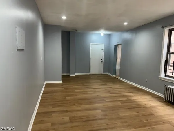 a view of an empty room with windows