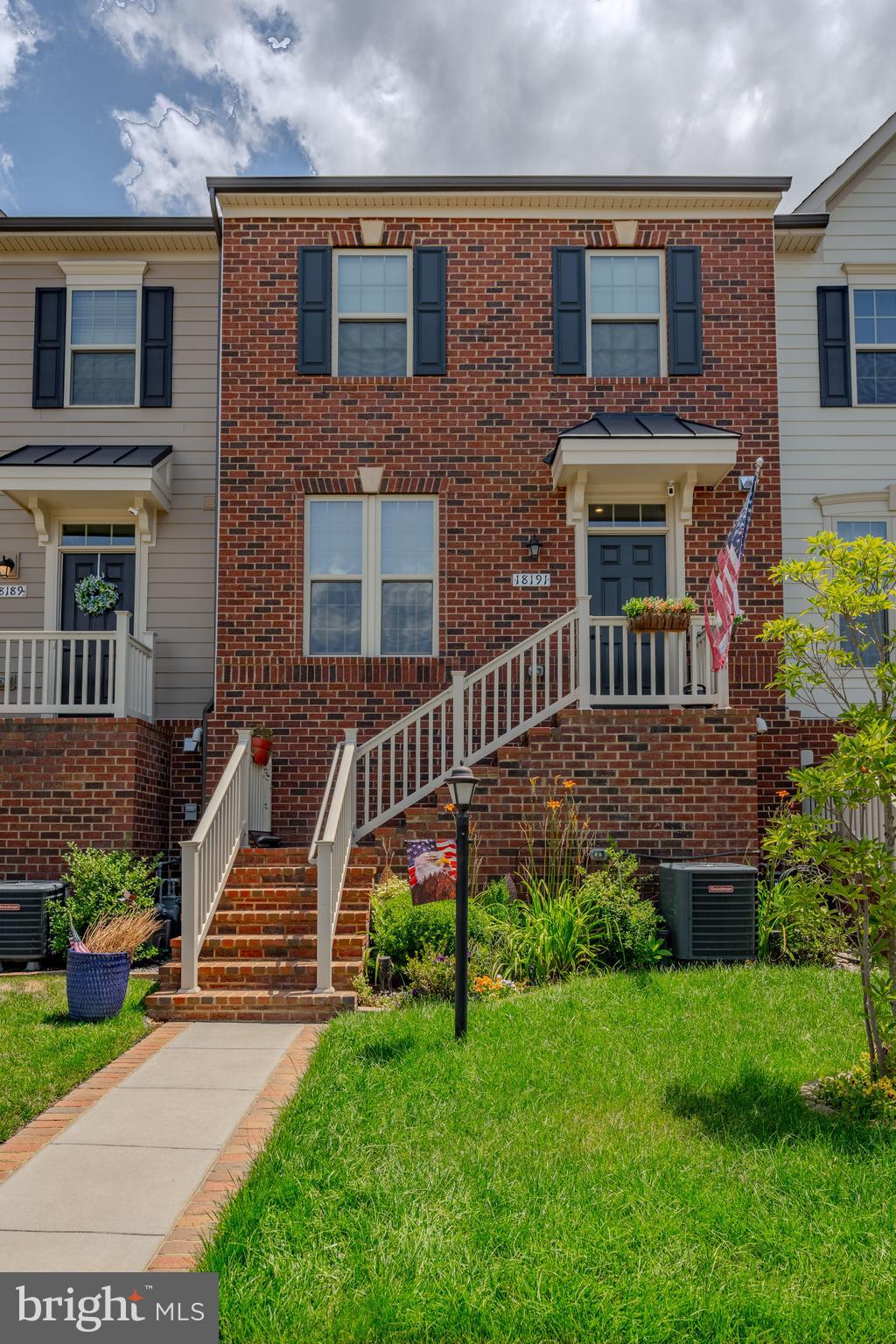 18191 Red Mulberry Road Dumfries, VA 22026 - Photo 15 of 42 a front view of a house with garden and deck