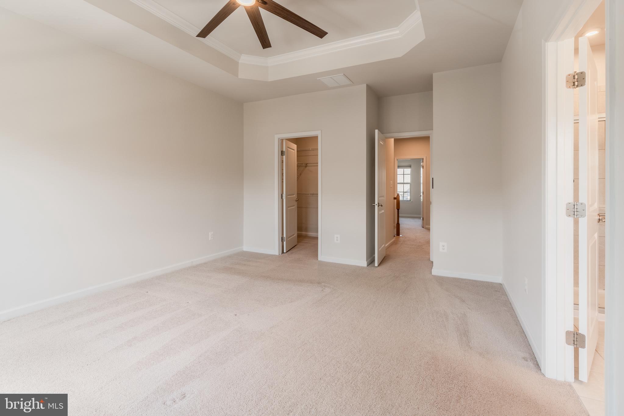 18191 Red Mulberry Road Dumfries, VA 22026 - Photo 19 of 42 an empty room with chandelier fan and closet