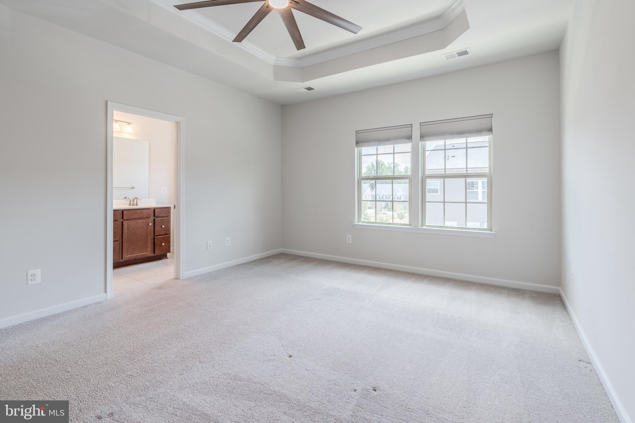 18191 Red Mulberry Road Dumfries, VA 22026 - Photo 22 of 42 an empty room with a ceiling fan and window