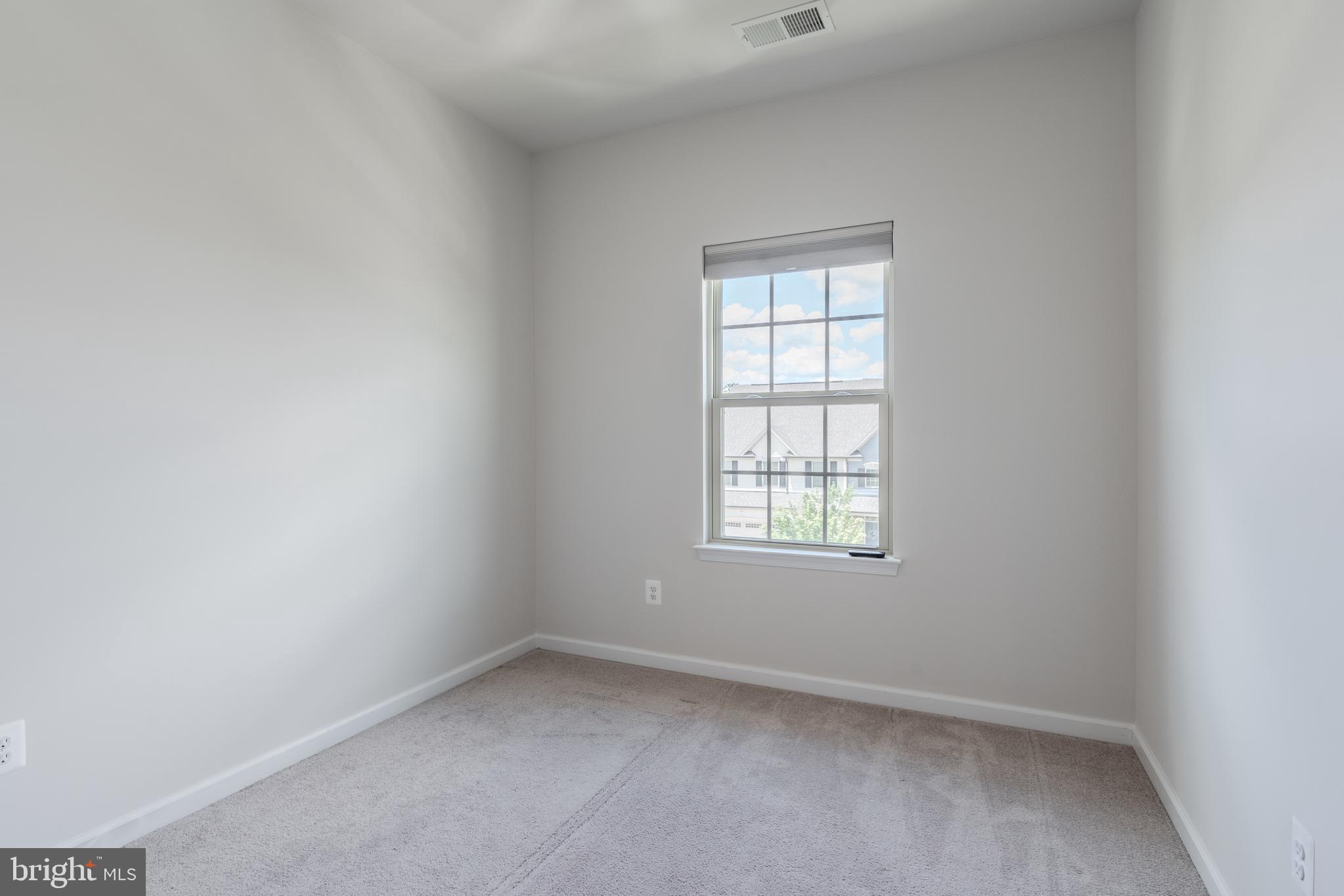 18191 Red Mulberry Road Dumfries, VA 22026 - Photo 30 of 42 an empty room with a window