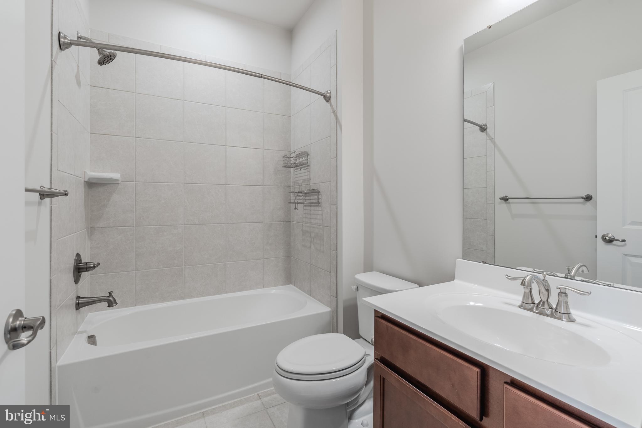 18191 Red Mulberry Road Dumfries, VA 22026 - Photo 36 of 42 a bathroom with a sink toilet and shower