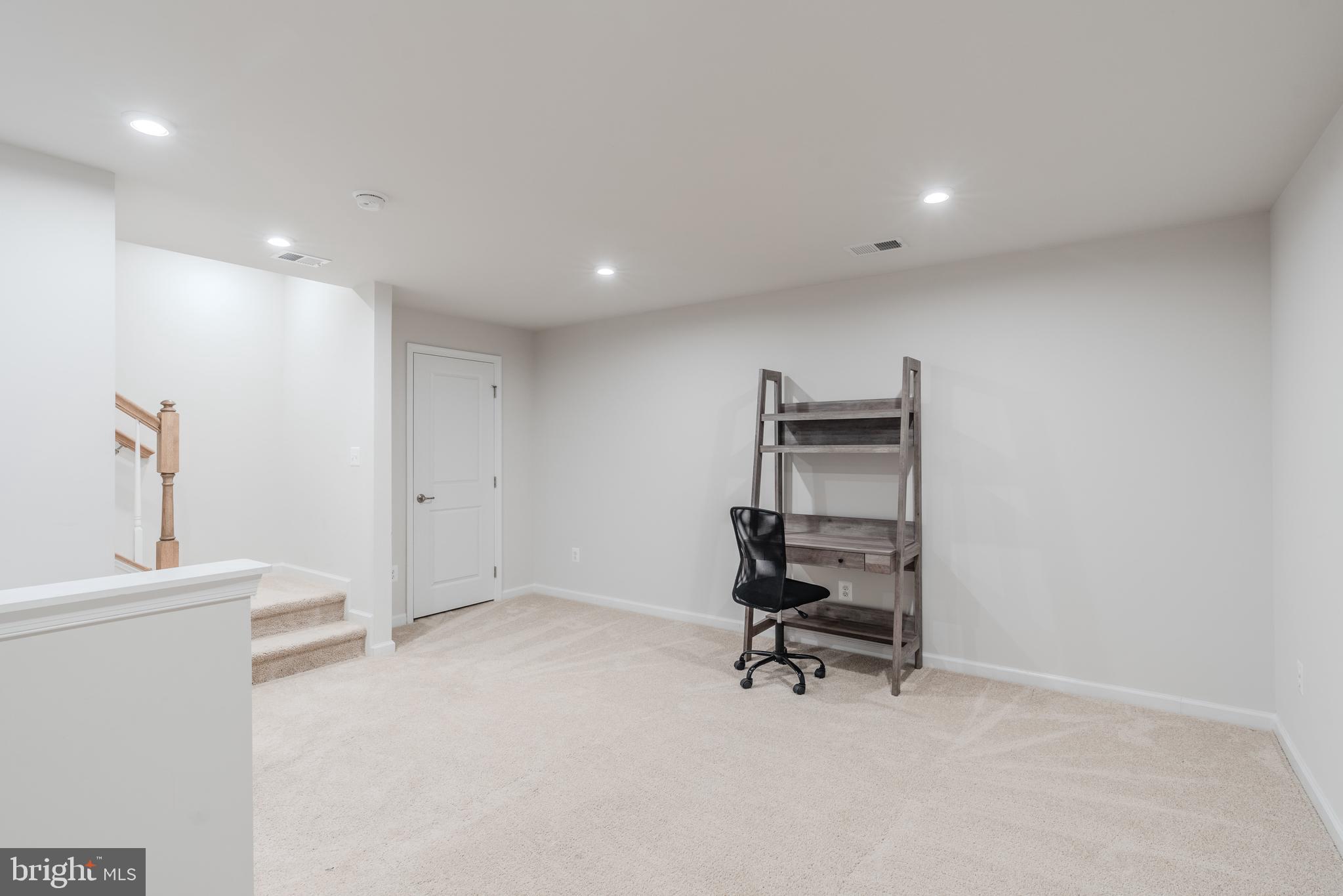 18191 Red Mulberry Road Dumfries, VA 22026 - Photo 40 of 42 a view of a room with a wooden floor and a sink
