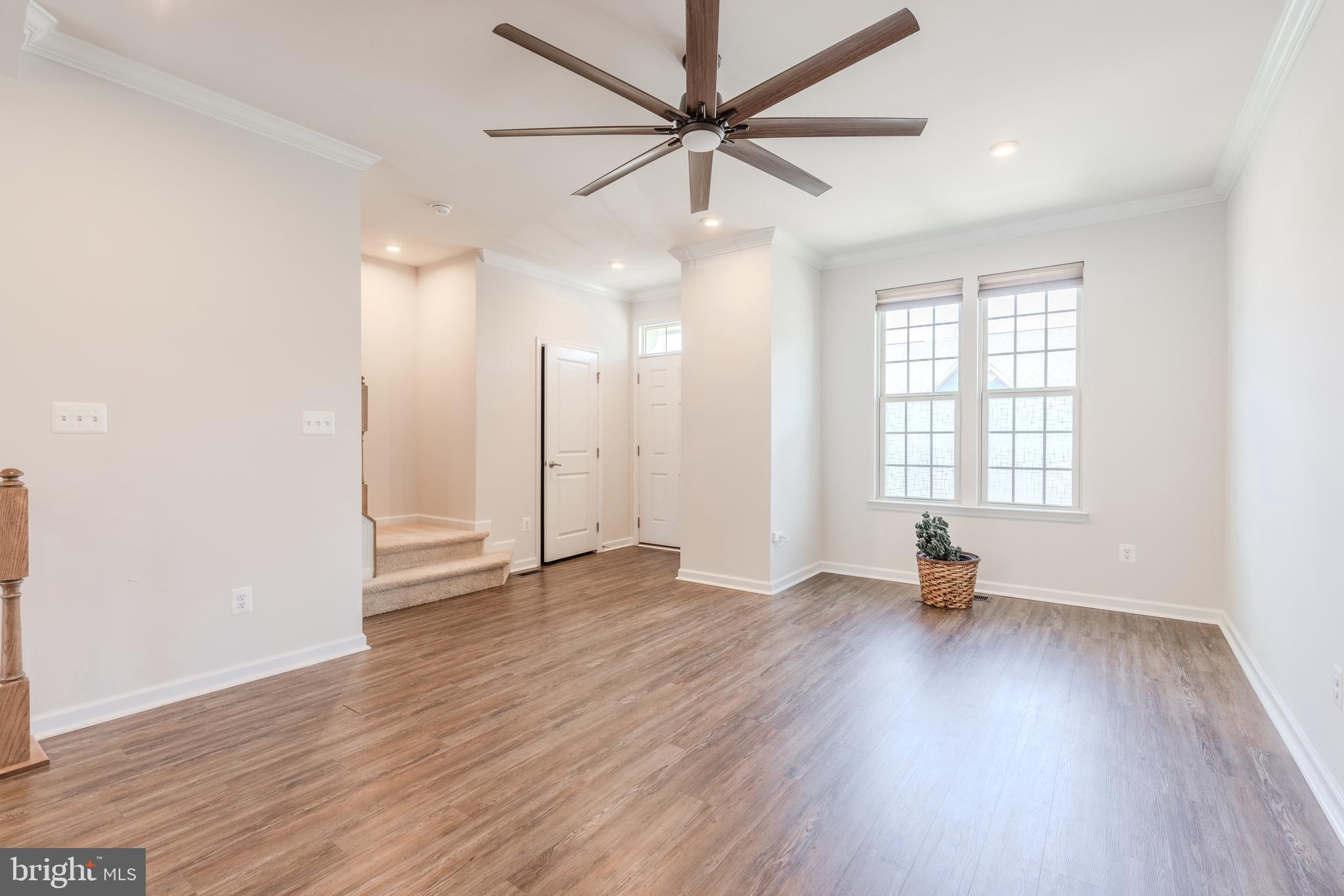 18191 Red Mulberry Road Dumfries, VA 22026 - Photo 8 of 42 a view of an empty room with window and wooden floor