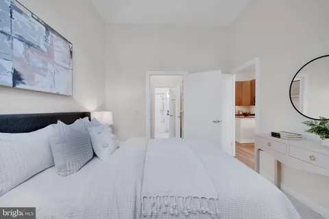 a large white bed in a white room