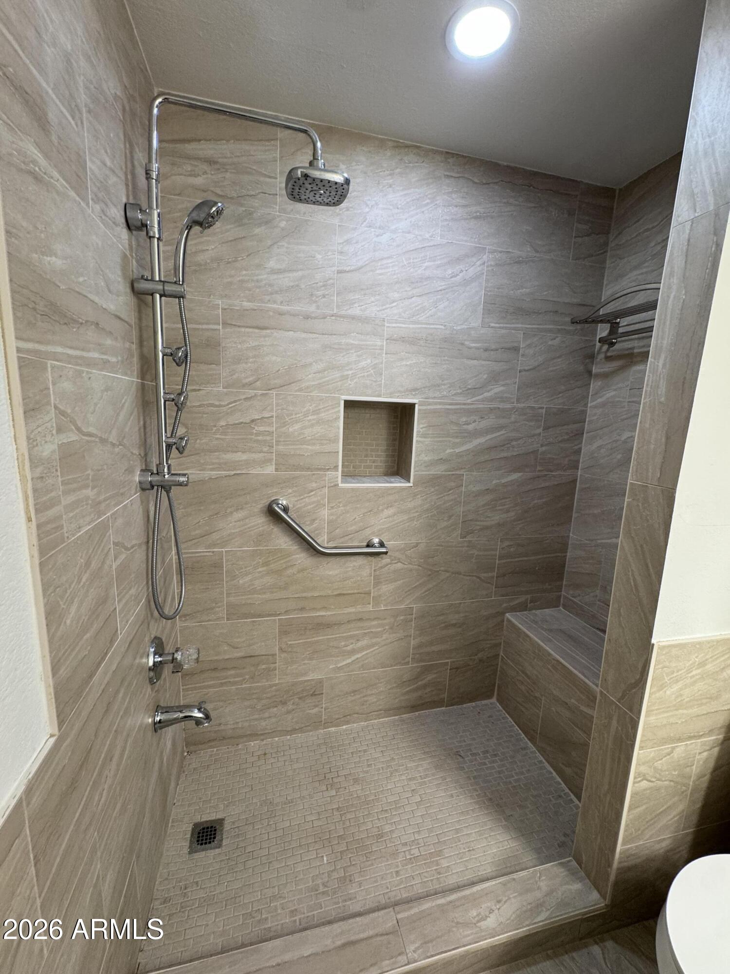 1645 West Baseline Road, Unit 1187 Mesa, AZ 85202 - Photo 14 of 16 a bathroom with a shower