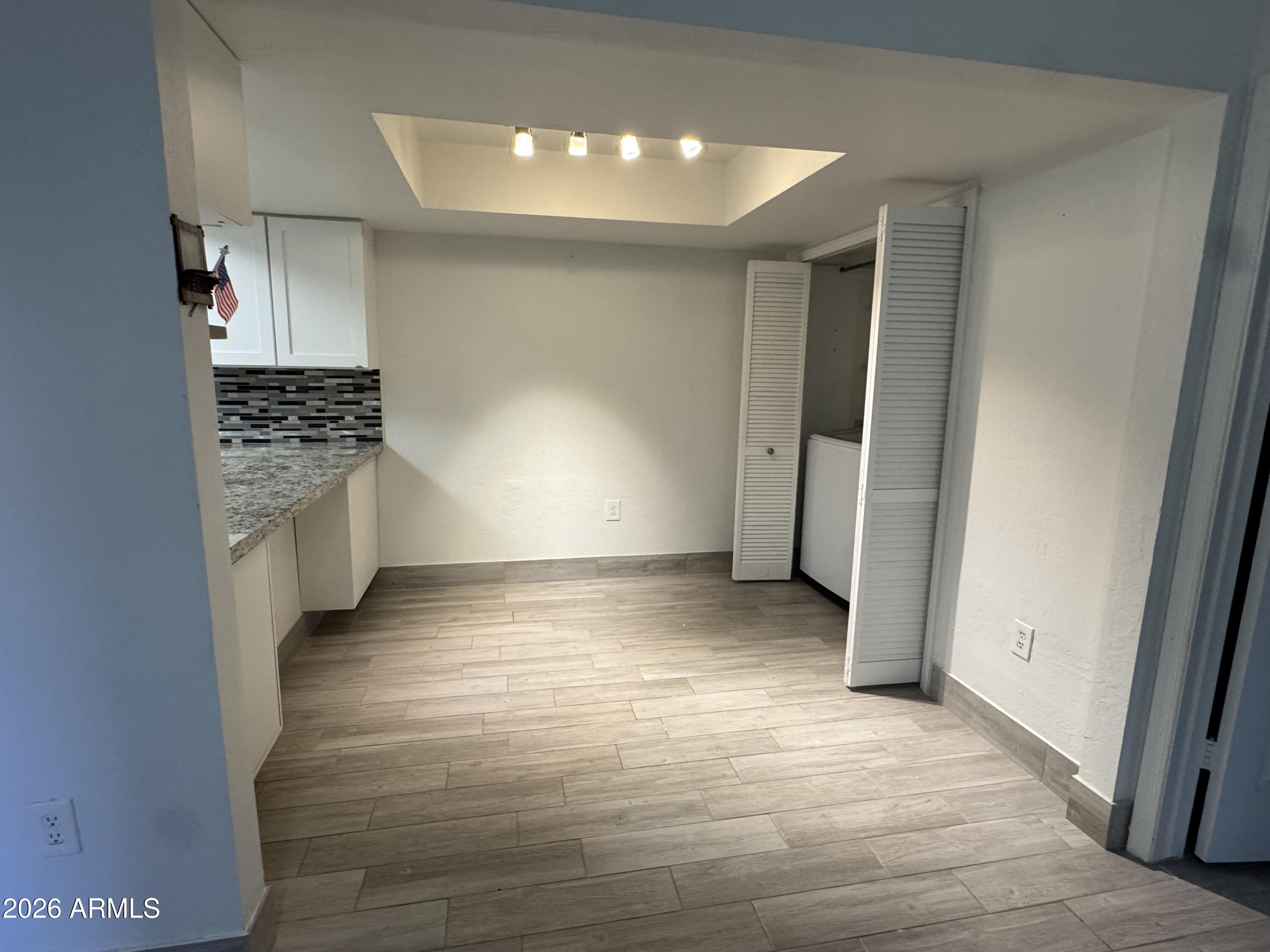 1645 West Baseline Road, Unit 1187 Mesa, AZ 85202 - Photo 6 of 16 a view of a kitchen with a sink and a stove