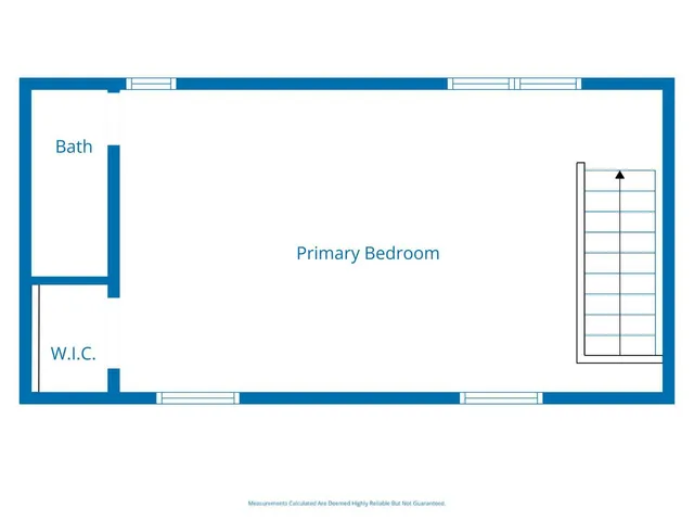 a bedroom with a bed and a flat screen television