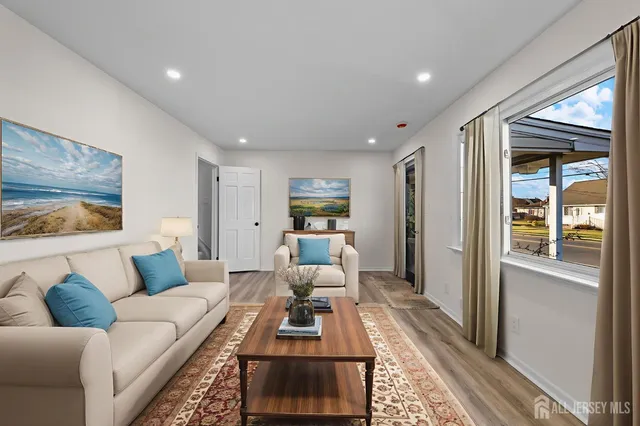 a kitchen with stainless steel appliances a stove sink and microwave