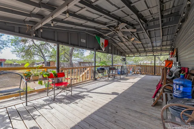 a view of a gym with wooden deck