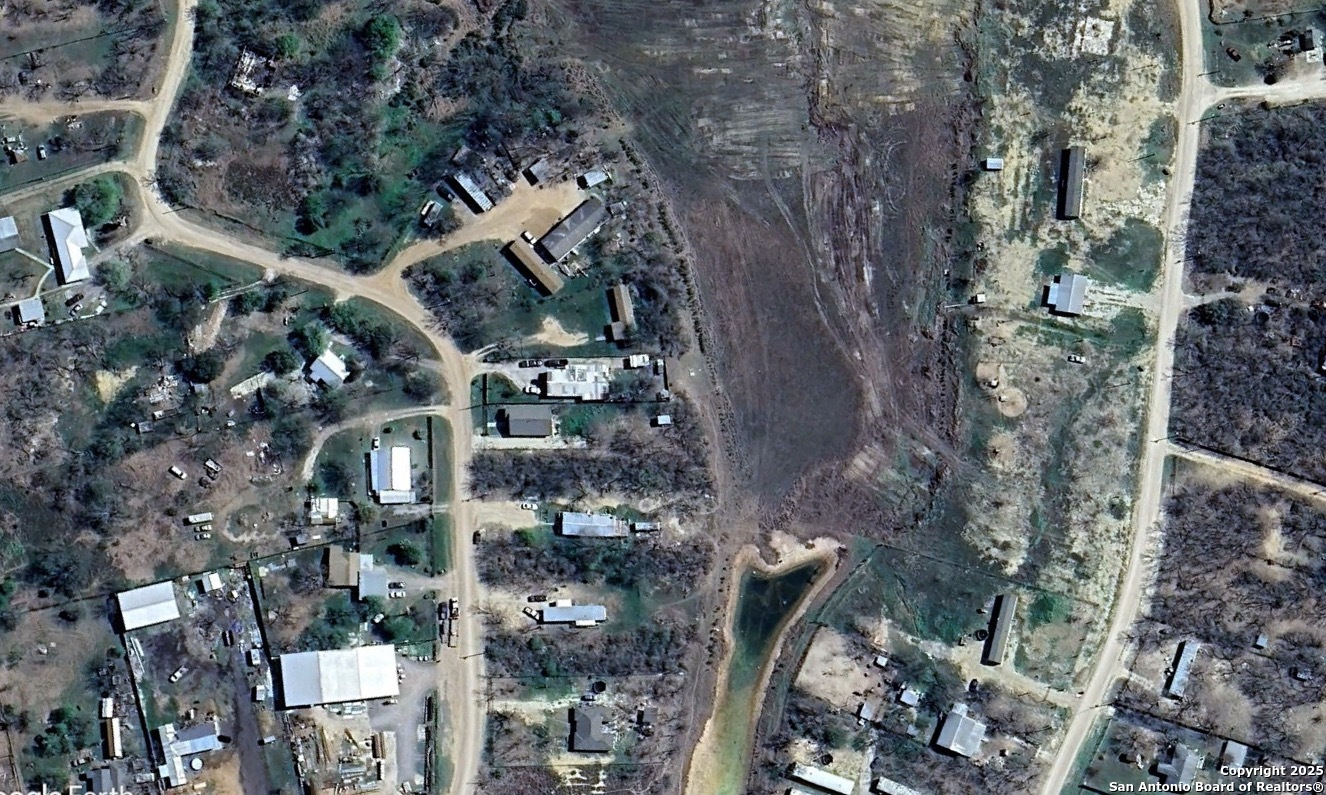 323 County Road 6842 Lytle, TX 78052 - Photo 22 of 25 an aerial view of a city