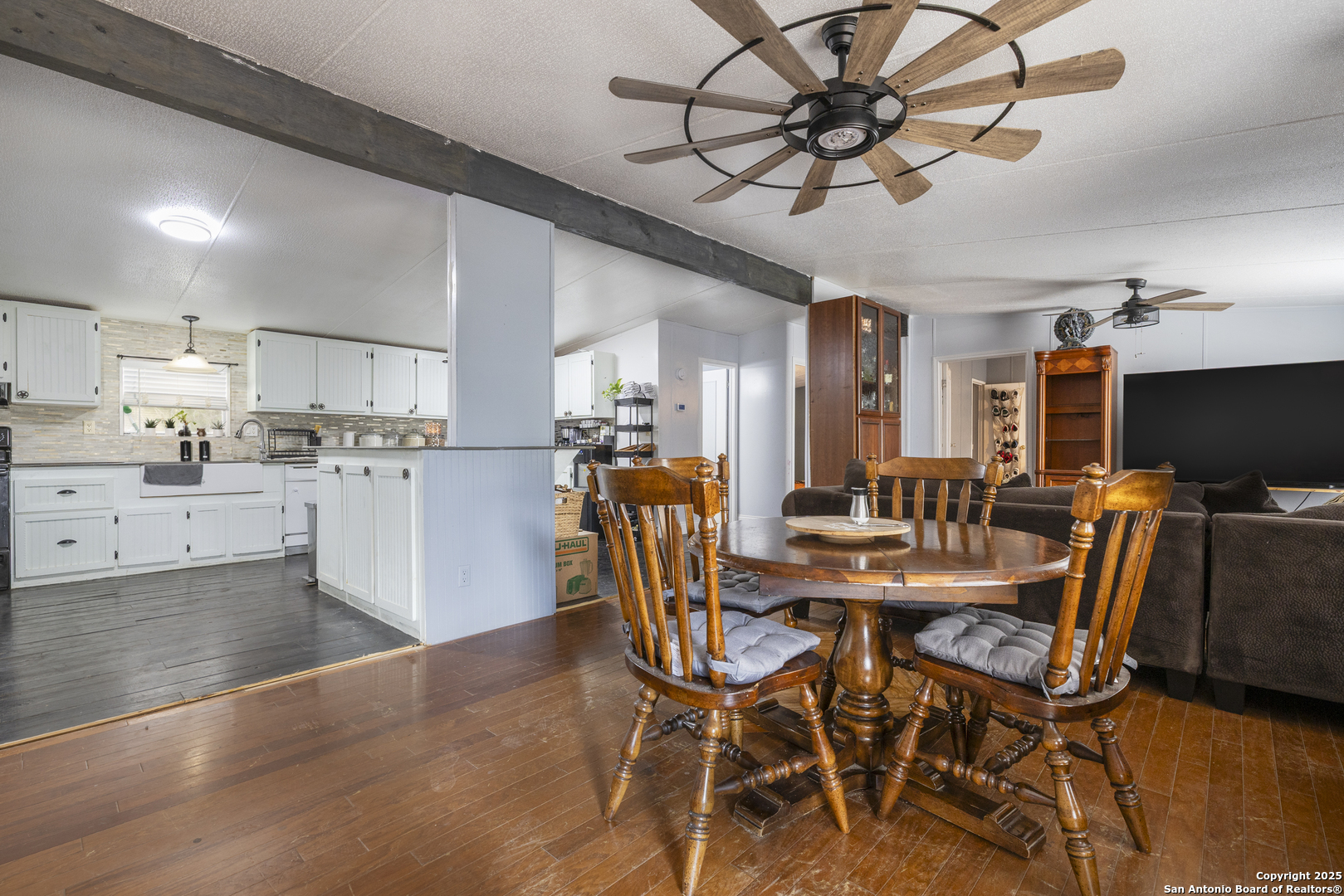 323 County Road 6842 Lytle, TX 78052 - Photo 4 of 25 a view of a dining room with furniture and a kitchen