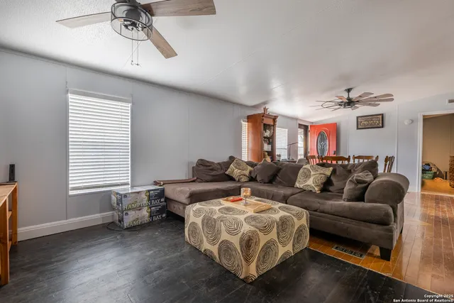 a living room with furniture and a window