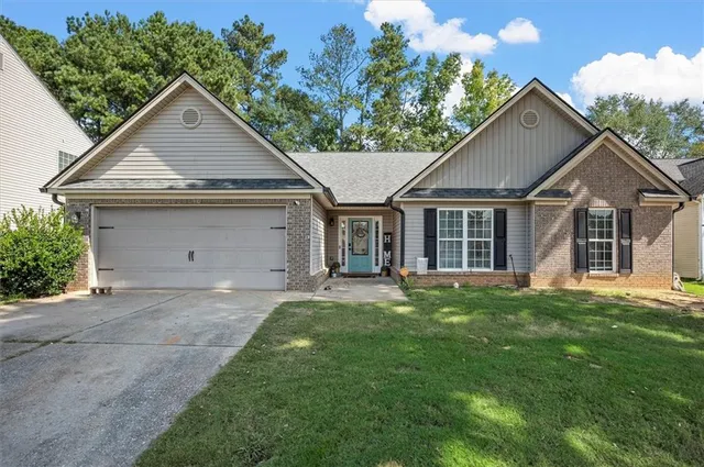 front view of a house with a yard