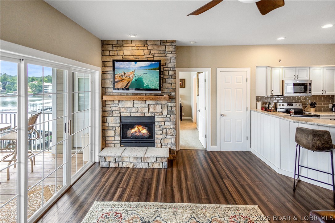 68 Lighthouse Road, Unit 121 Lake Ozark, MO 65049 - Photo 21 of 30 Fireplace in living area.