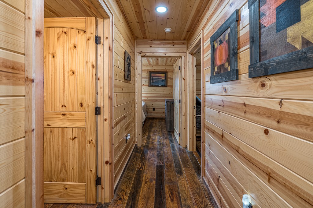 110 Sawtooth Rdg Road Murphy, NC 28906 - Photo 17 of 37 a view of a hallway with wooden floor and staircase