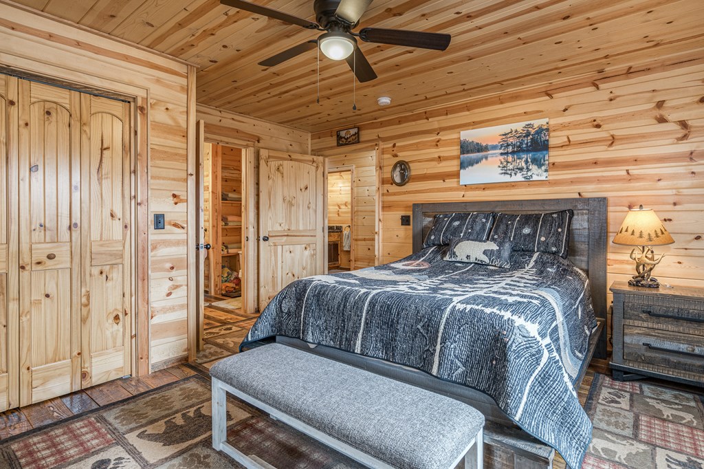 110 Sawtooth Rdg Road Murphy, NC 28906 - Photo 19 of 37 a bedroom with a bed and wooden floor