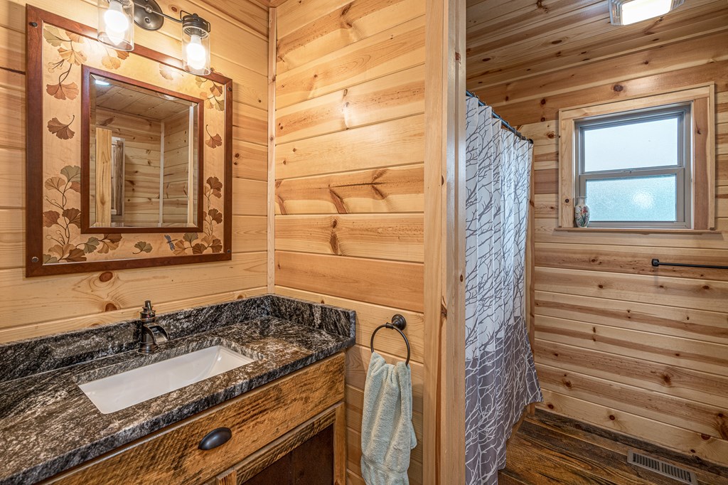 110 Sawtooth Rdg Road Murphy, NC 28906 - Photo 24 of 37 a bathroom with a granite countertop sink and a mirror