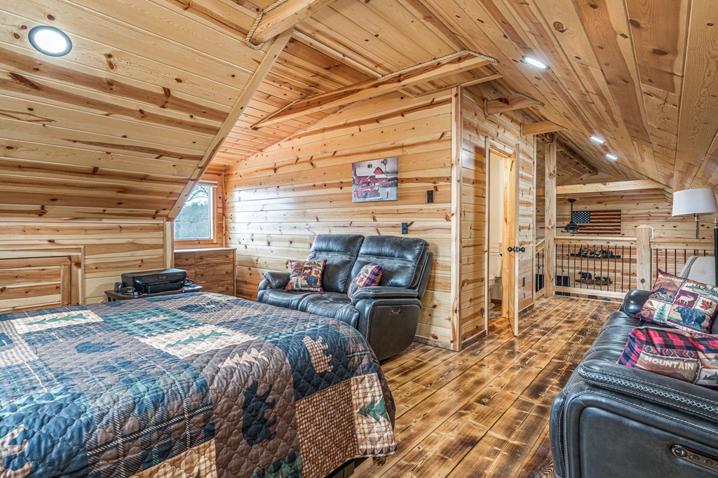 110 Sawtooth Rdg Road Murphy, NC 28906 - Photo 29 of 37 a bed room with a bed and a couch