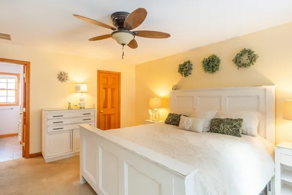 a bedroom with a bed and cabinets