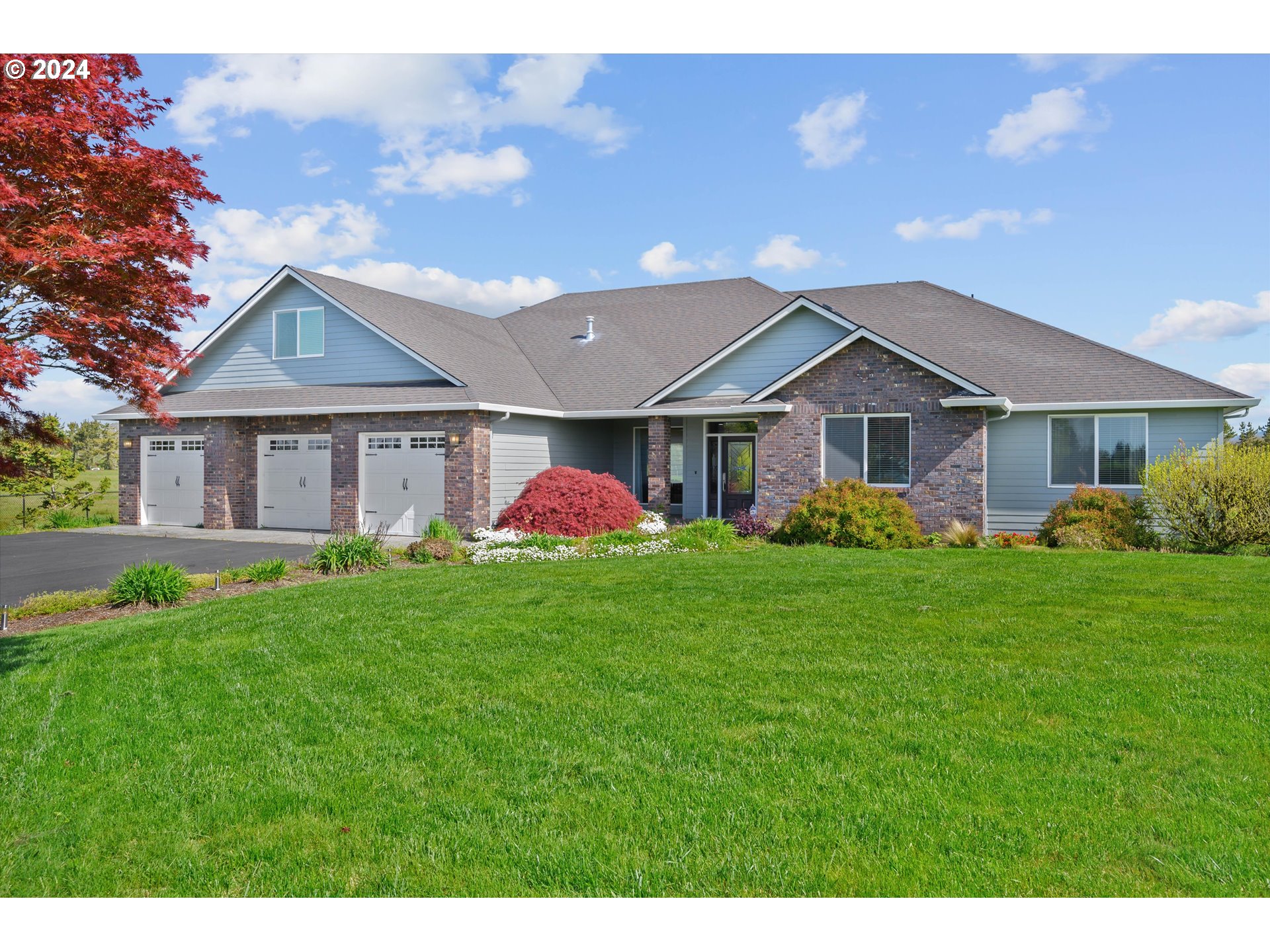 4216 Northwest 289th Street Ridgefield, WA 98642 - Photo 1 of 40 a front view of a house with a yard