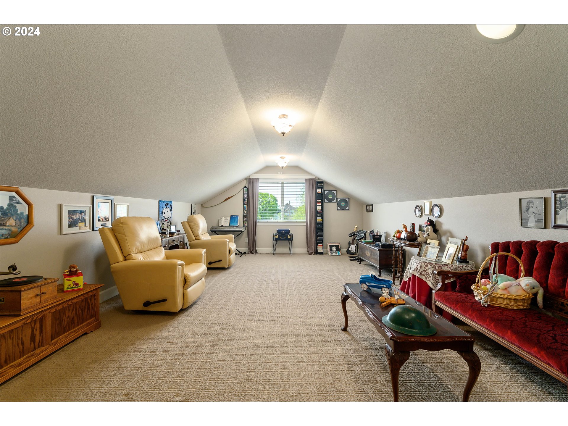 4216 Northwest 289th Street Ridgefield, WA 98642 - Photo 28 of 40 a living room with furniture and a clock