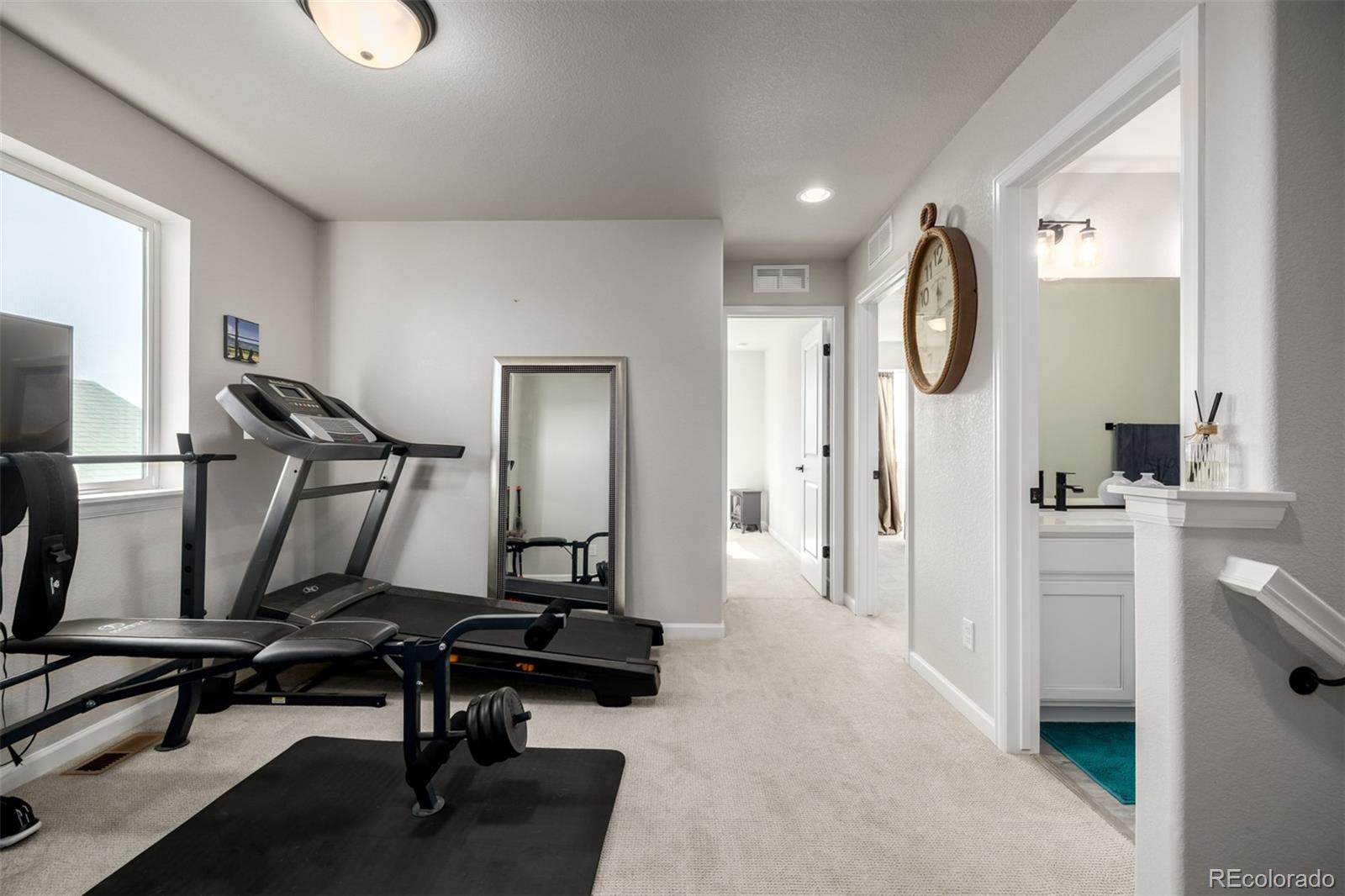 1875 Rancher Drive Milliken, CO 80543 - Photo 23 of 50 a view of a hallway with workspace
