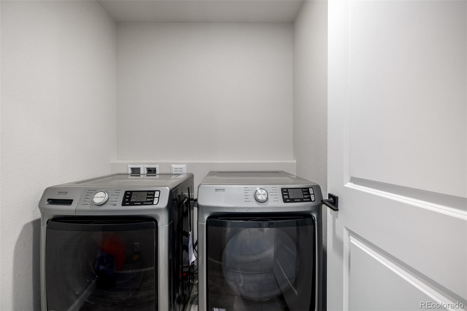 1875 Rancher Drive Milliken, CO 80543 - Photo 30 of 50 a utility room with dryer and washer