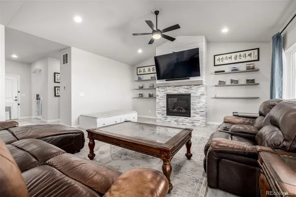 a living room with furniture and a flat screen tv
