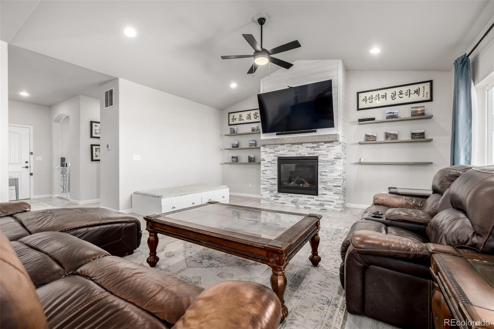 1875 Rancher Drive Milliken, CO 80543 - Photo 4 of 50 a living room with furniture and a flat screen tv