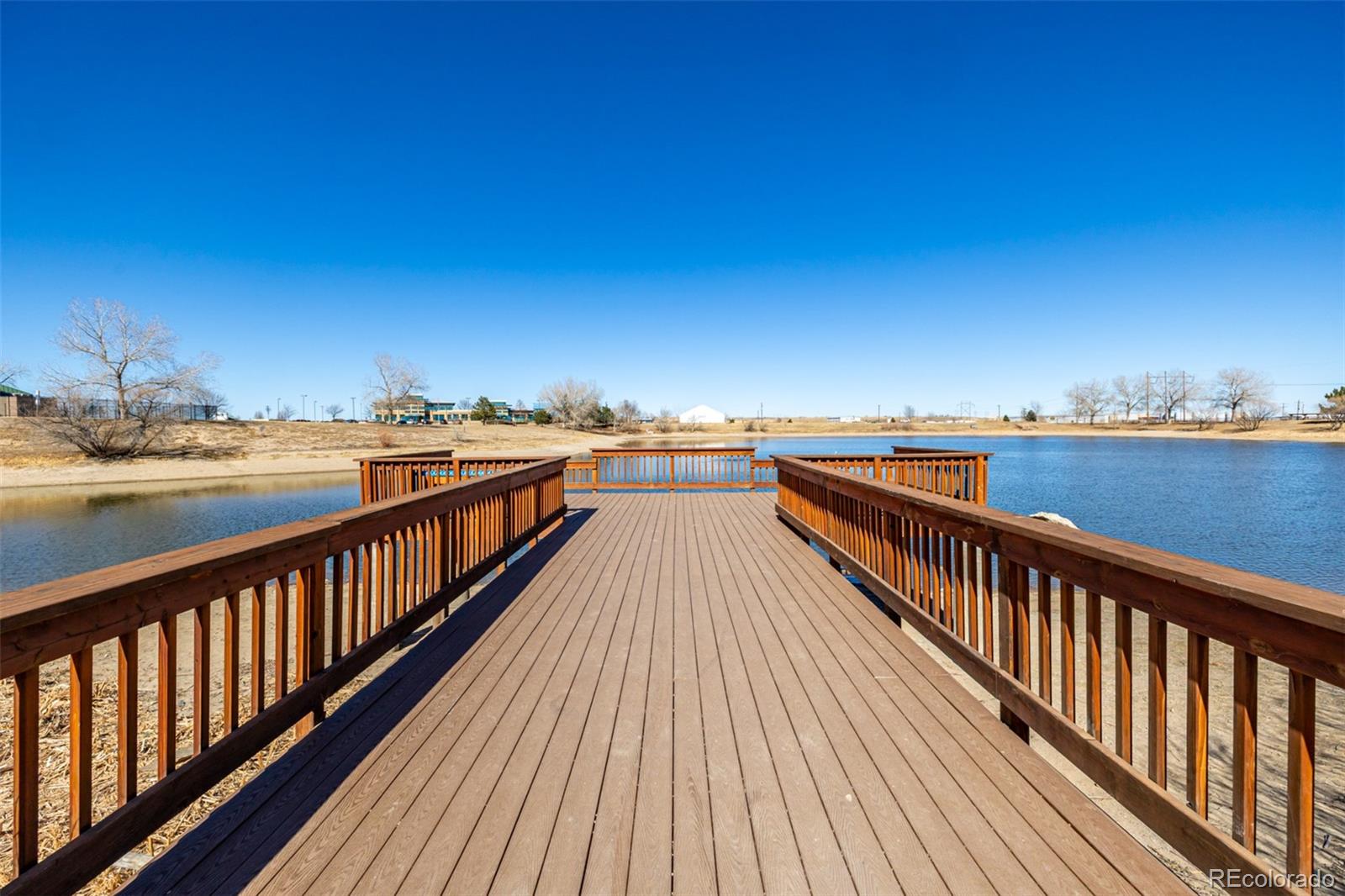 1875 Rancher Drive Milliken, CO 80543 - Photo 49 of 50 a view of balcony with wooden floor and city view