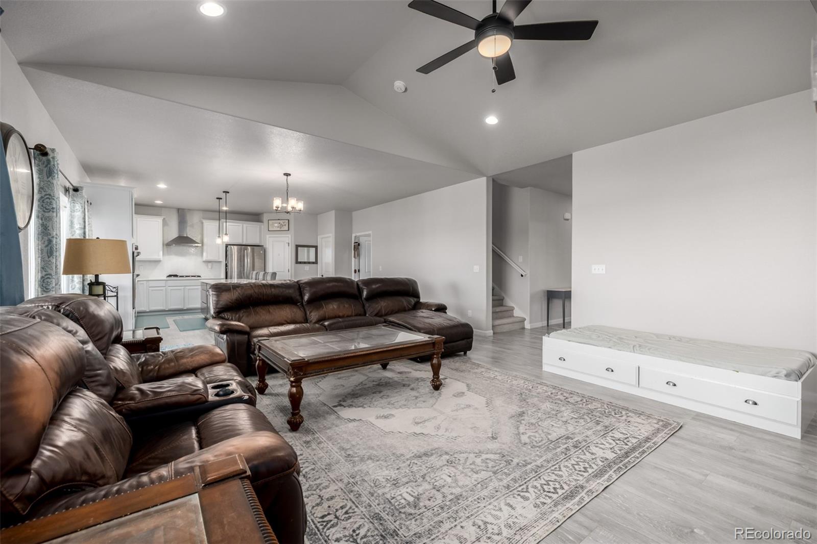 1875 Rancher Drive Milliken, CO 80543 - Photo 5 of 50 a living room with furniture and a rug