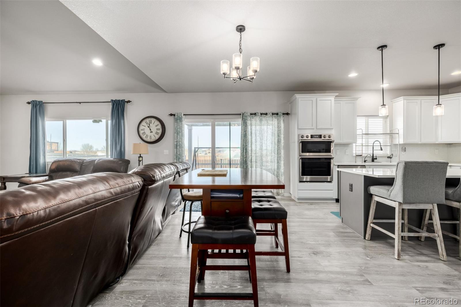 1875 Rancher Drive Milliken, CO 80543 - Photo 6 of 50 a large kitchen with a table and chairs