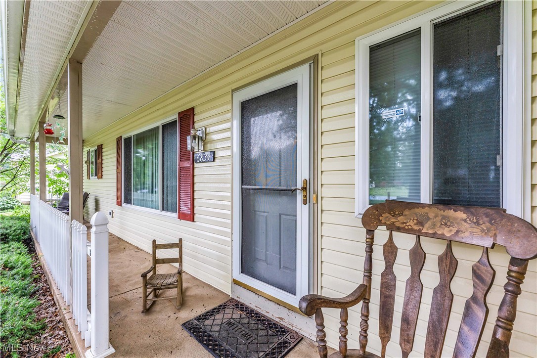 6834 Glendale Road North Ridgeville, OH 44039 - Photo 3 of 37 Doorway to property featuring a porch