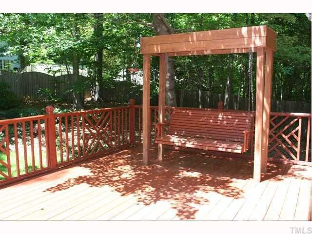 Family room opens onto a large private deck with built-in swing. Great outdoor living space perfect for relaxing and entertaining. Back Yard