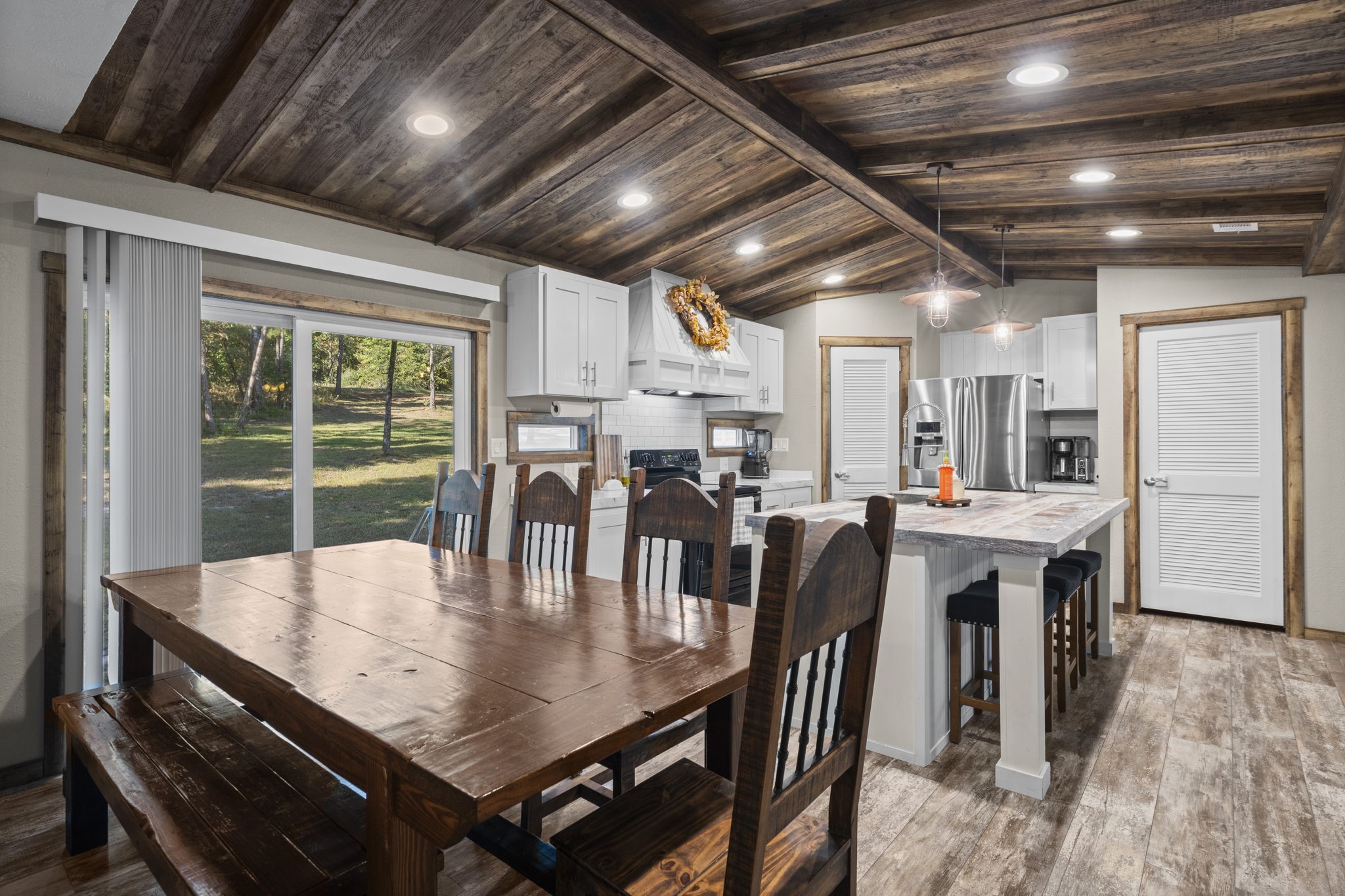 577 Winding River Road South Oakhurst, TX 77359 - Photo 11 of 31 a view of a dining room with furniture window and outside view