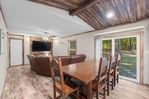 a view of a dining room with furniture window and wooden floor