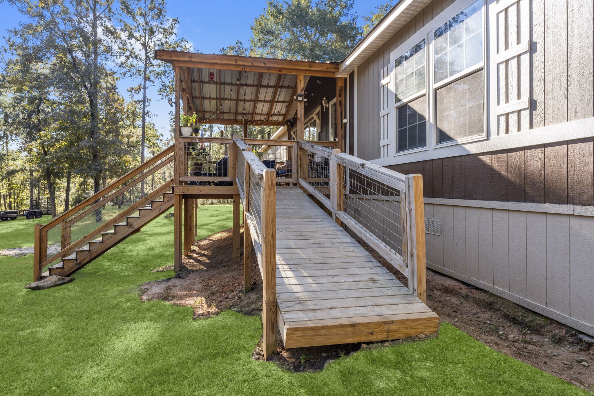 577 Winding River Road South Oakhurst, TX 77359 - Photo 2 of 31 a view of a house with a yard