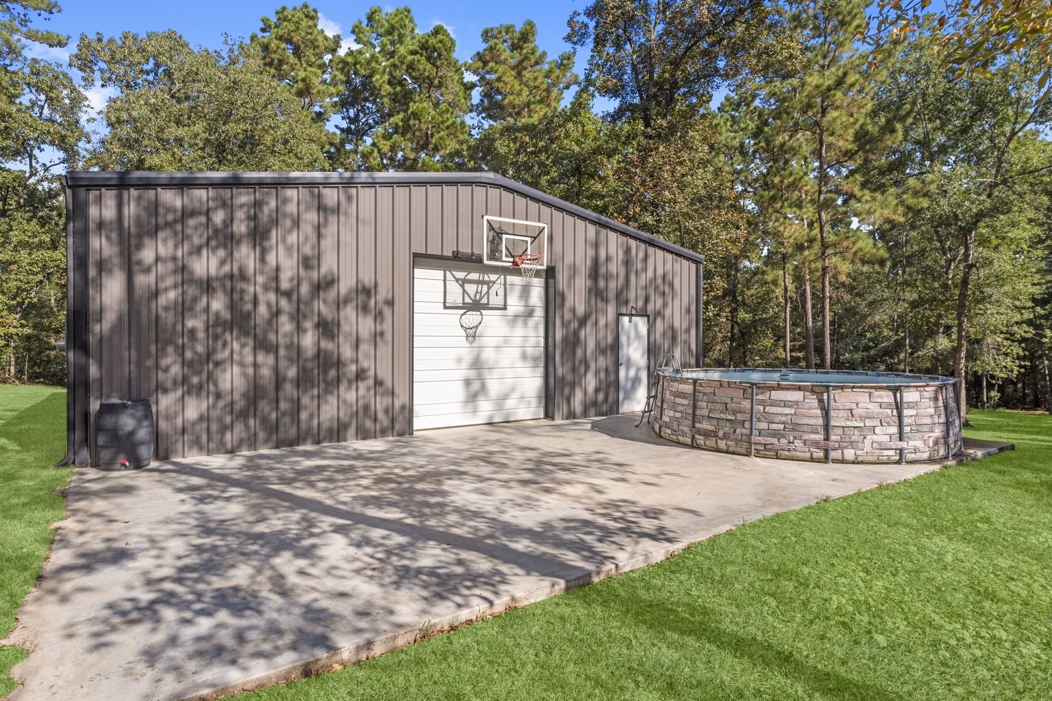 577 Winding River Road South Oakhurst, TX 77359 - Photo 27 of 31 a wooden fence with trees in the background