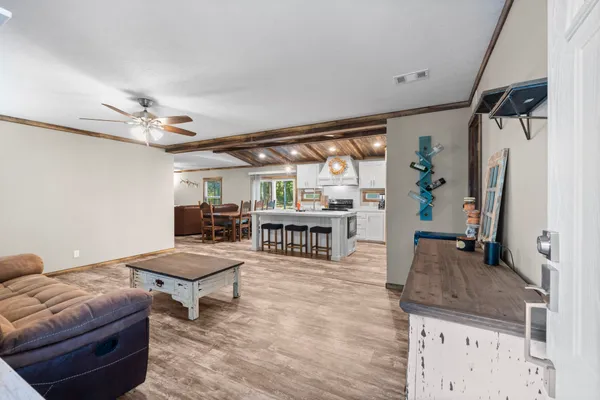 a living room with furniture and a table