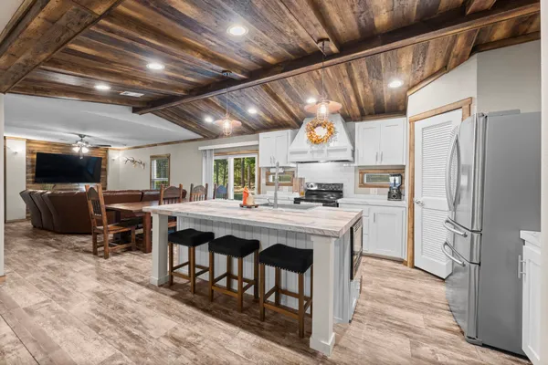 a kitchen with lots of counter top space and appliances