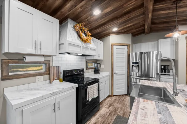 a kitchen with refrigerator cabinets and a counter top space