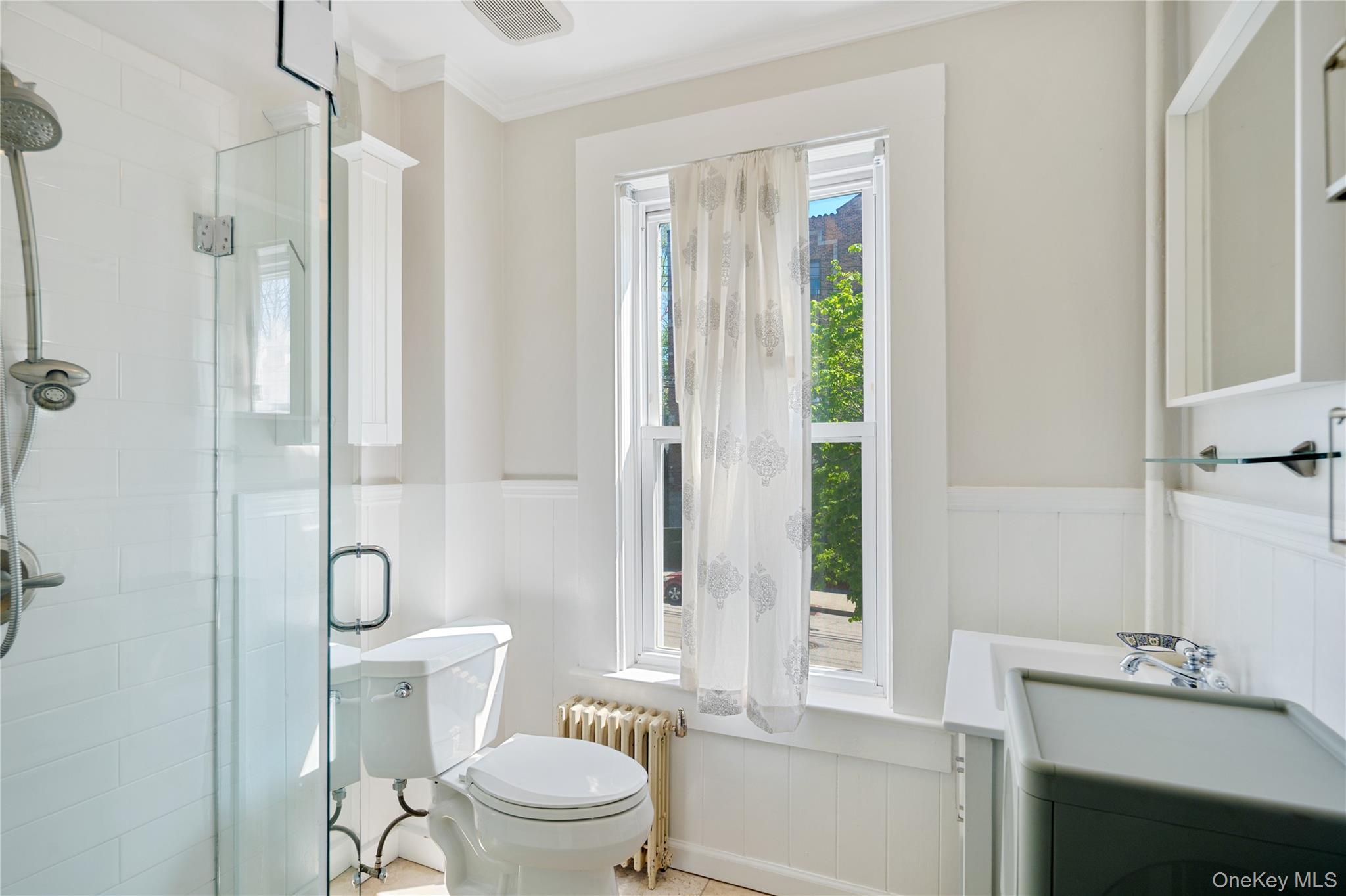 200 Nelson Avenue Peekskill, NY 10566 - Photo 23 of 41 Bright, sparkling 2nd floor full bath with frameless glass shower enclosure, stationary and adjustable shower heads