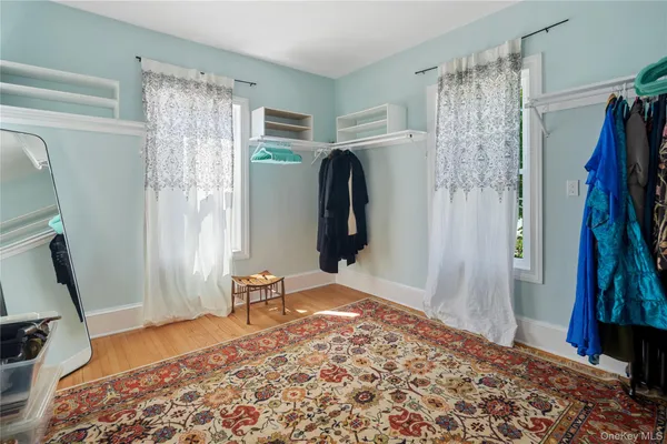 a bedroom with two beds and a chandelier