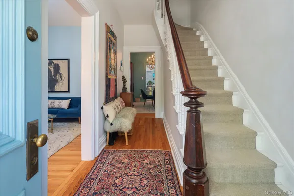 a hallway with furniture and a rug