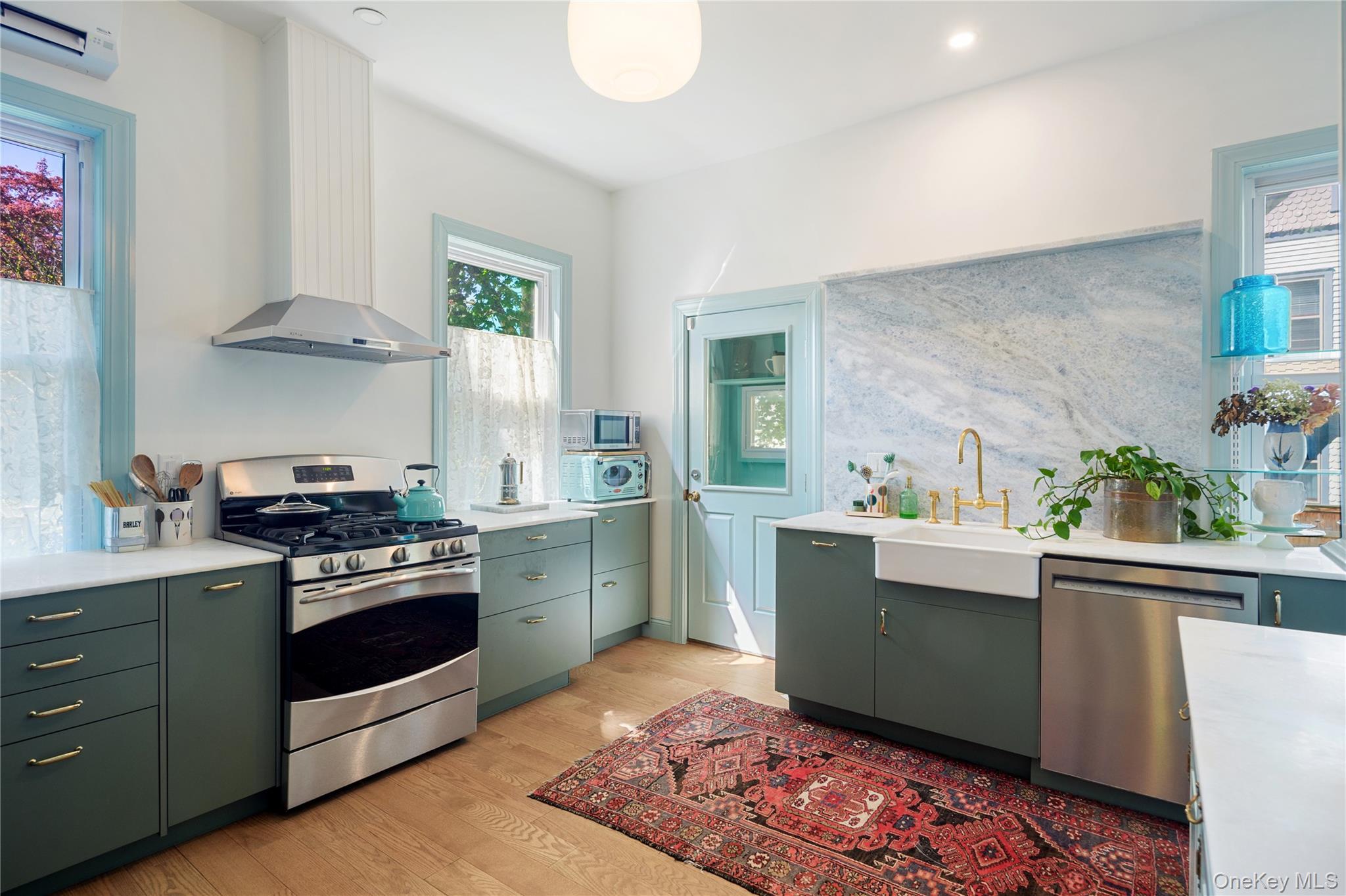 200 Nelson Avenue Peekskill, NY 10566 - Photo 6 of 41 Newly renovated kitchen with top-of-the-line appliances, honed quartzite counters, French white oak wide board floors, door to mud room