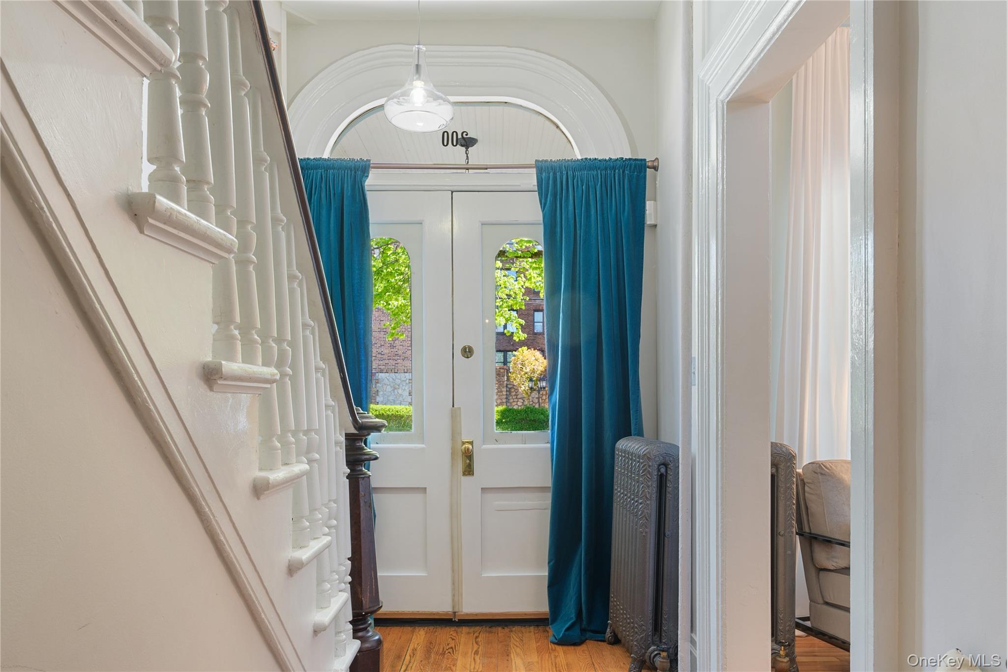 200 Nelson Avenue Peekskill, NY 10566 - Photo 9 of 41 Entry hall with double doors with arched windows and transom window above