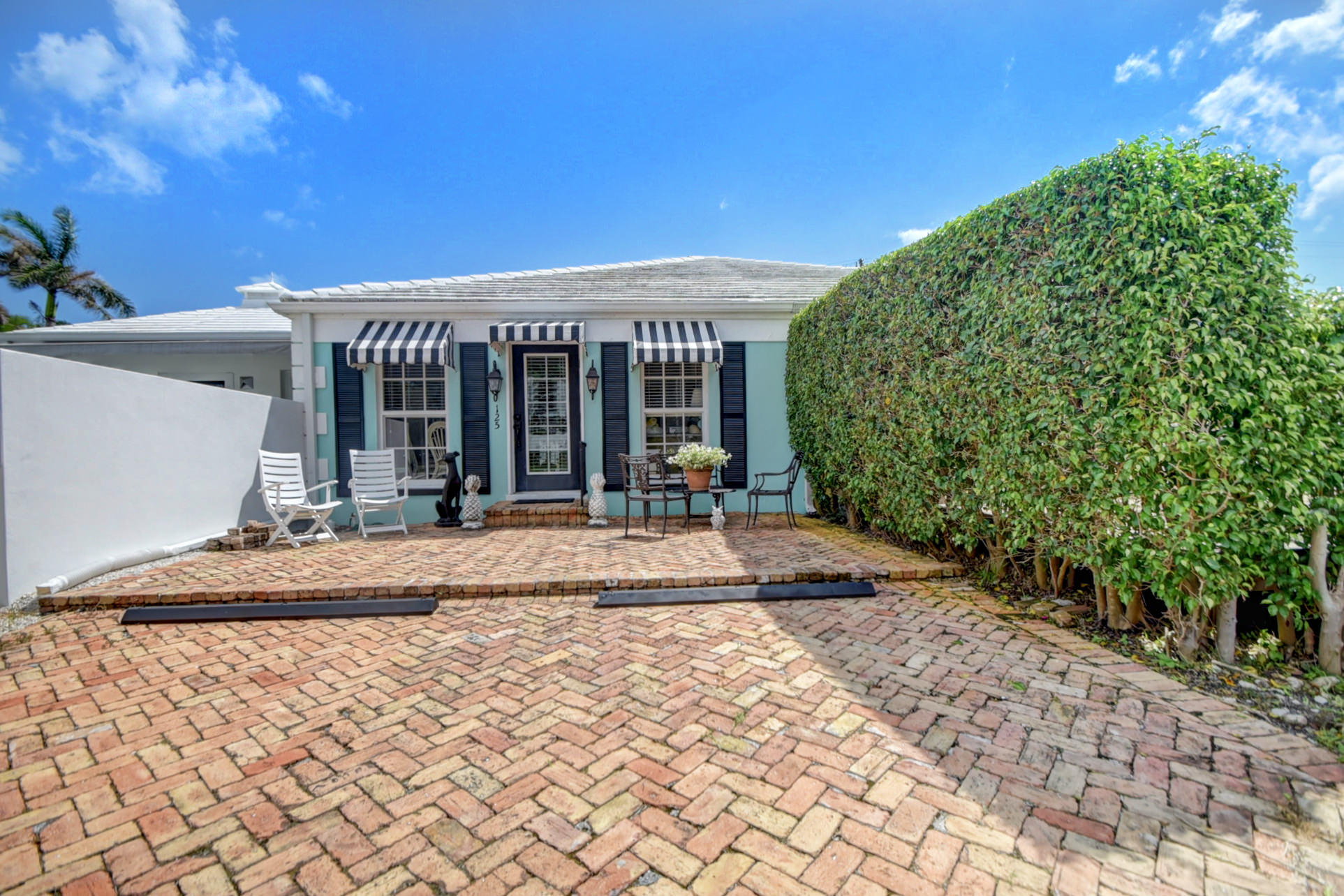 125 Mac Farlane Drive Delray Beach, FL 33483 - Photo 1 of 20 a view of a house with backyard porch and sitting area