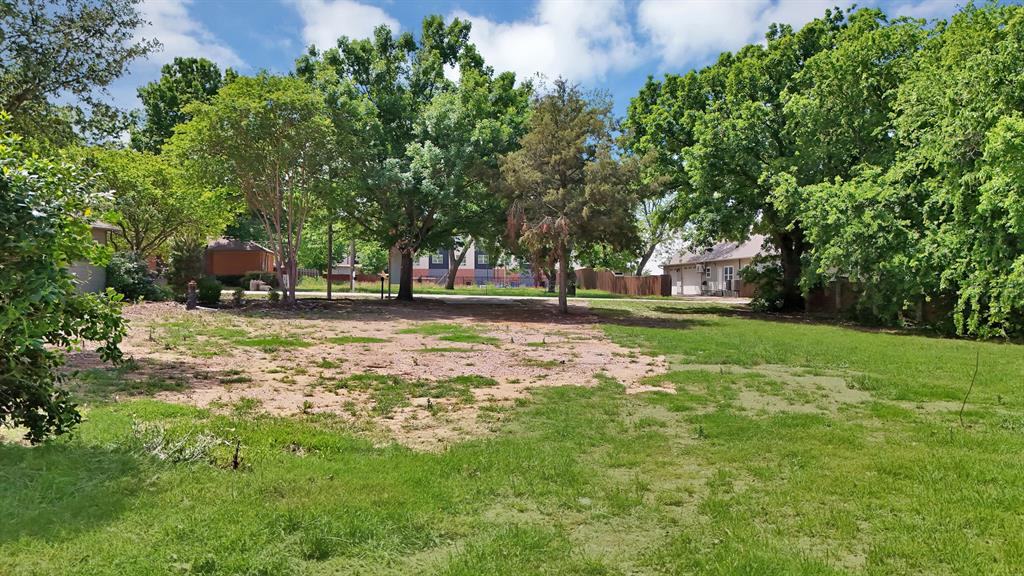 6868 Pecan Street Frisco, TX 75034 - Photo 4 of 8 Spacious lot featuring mature trees and partial fencing